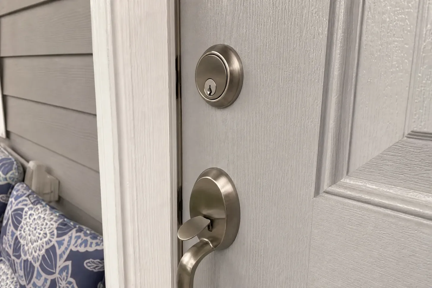 New deadbolt being installed in a front door in Keller, TX